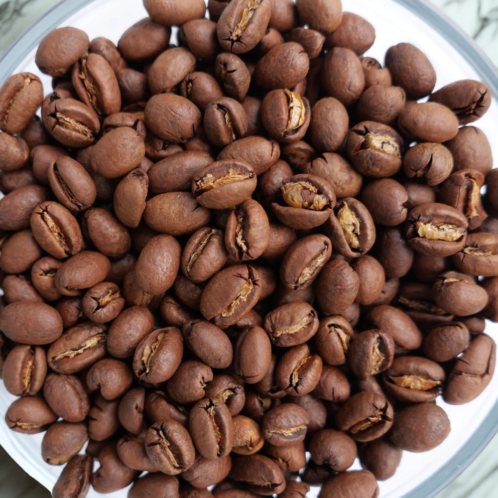 Kona Peaberry coffee close up sitting on countertop